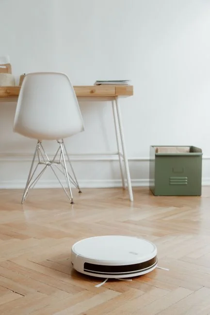 Minimalist desk with a focus on a multipurpose cleaner, office supplies, and storage solutions.